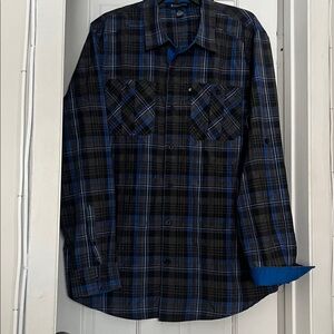 New Rocawear Black and Blue Checkered
shirt. 55 percent cotton.